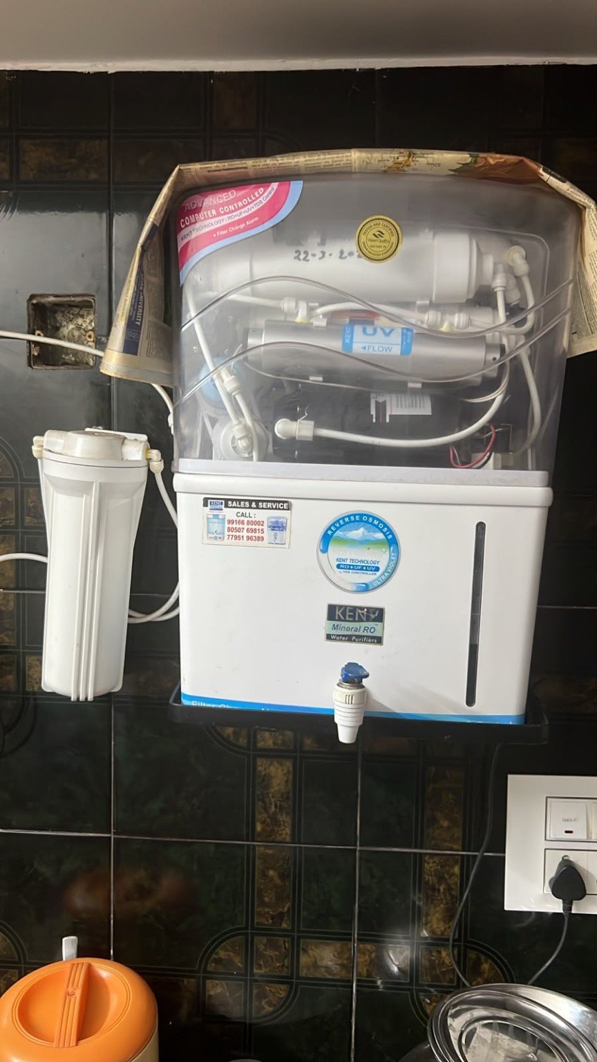 Technician servicing water purifier